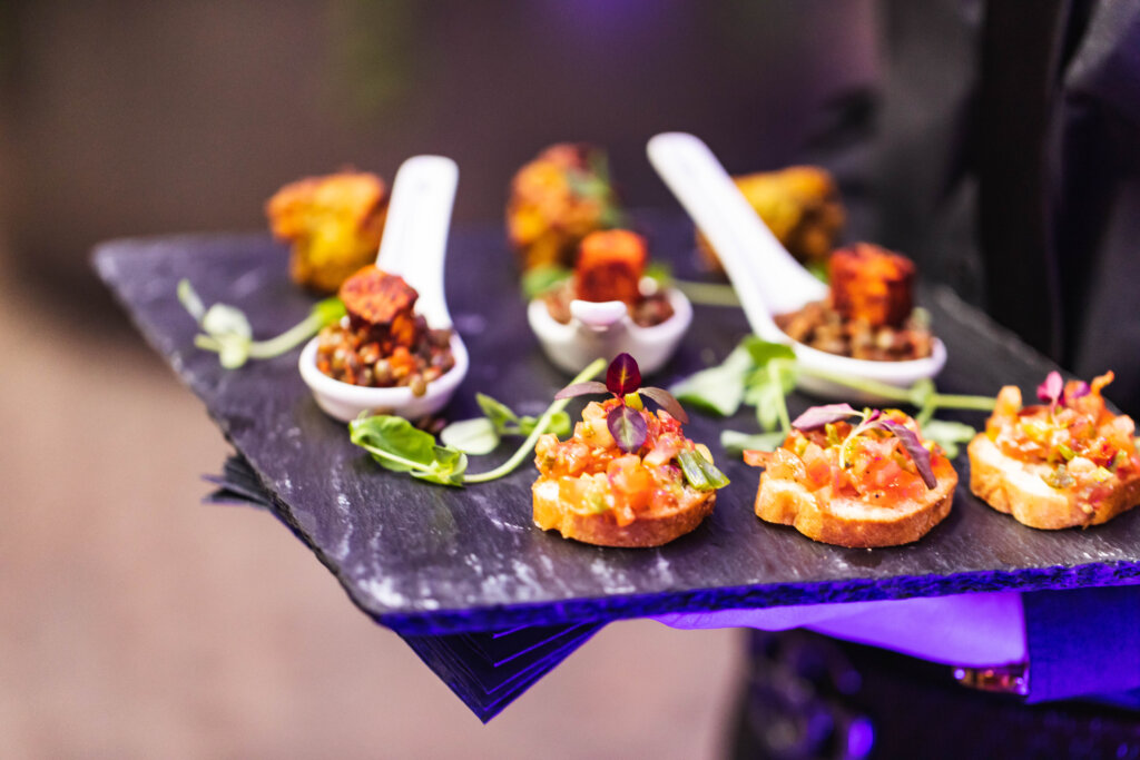 Canapes on spoons and slate